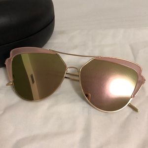 Pink sunglasses with green lens